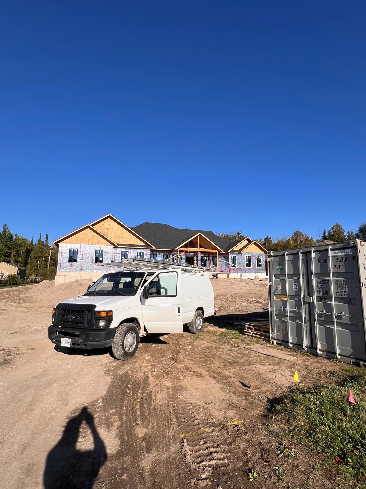 The Double AA's Roofing crew van on job site