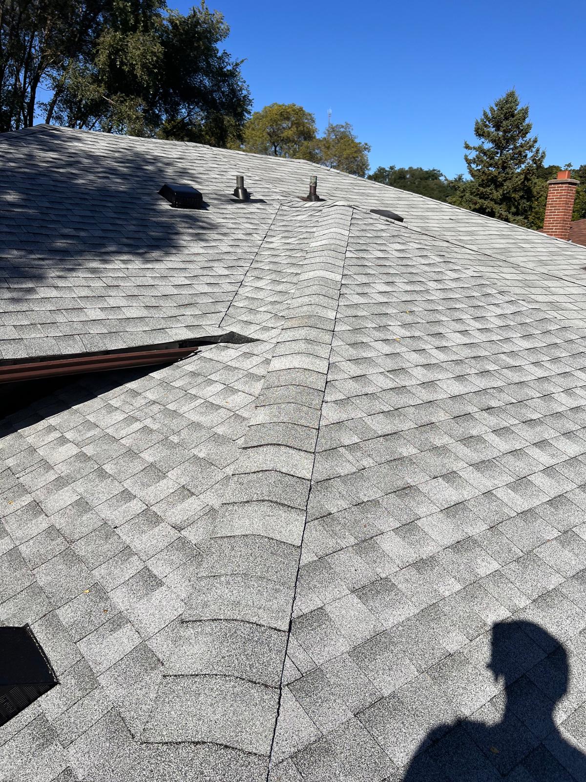 Wide-angle view of completed architectural shingle roof